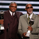 Tommie Smith, left, and John Carlos accept the Arthur Ashe Award for Courage as they were given the award for their black-gloved fist salute at the 1968 Mexico City Olympics onstage at the 2008 ESPY Awards held at NOKIA Theatre L.A. on July 16, 2008 in Los Angeles, California.